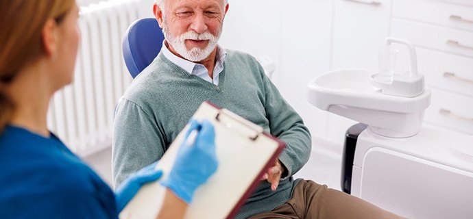 Male patient listening to dentist