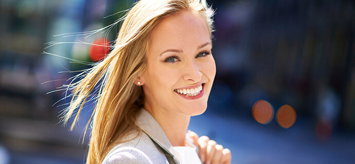 blonde woman smiling brightly