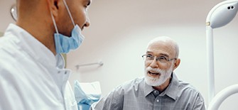 man asking his denture dentist in Indianapolis questions about dentures 