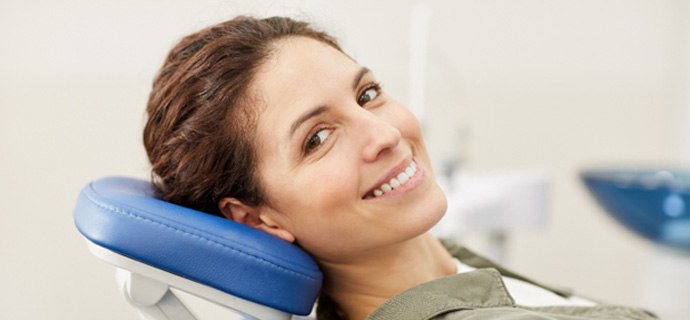 A smiling woman who received root canal therapy in Indianapolis