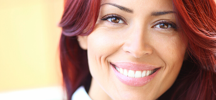 woman with red hair smiling