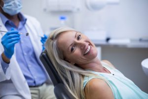 Woman smiling in dentist's chair.