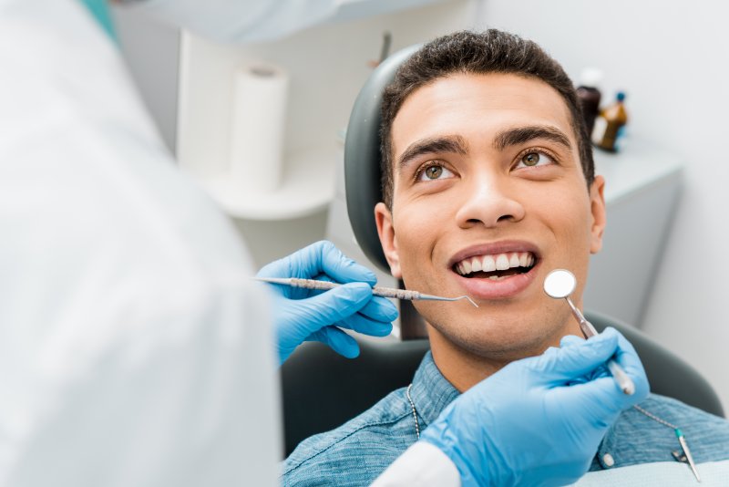 young man receiving a dental checkup in Indianapolis  